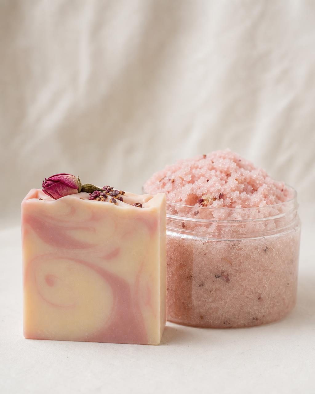 New handmade soap bar and sugar scrub jar on a soft cream backdrop